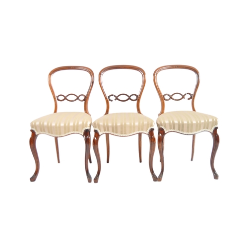 699 - A set of six 19th Century Victorian rosewood & mahogany balloon back dining chairs. Carved pierced b... 