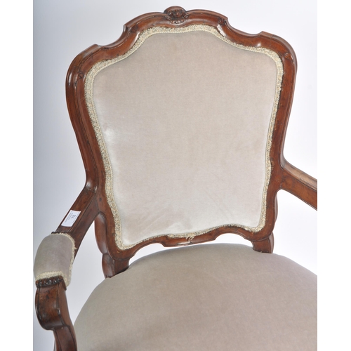 78 - A 19th Century French carved walnut fauteuil armchair / arm chair. Carved shell backrest with cushio... 