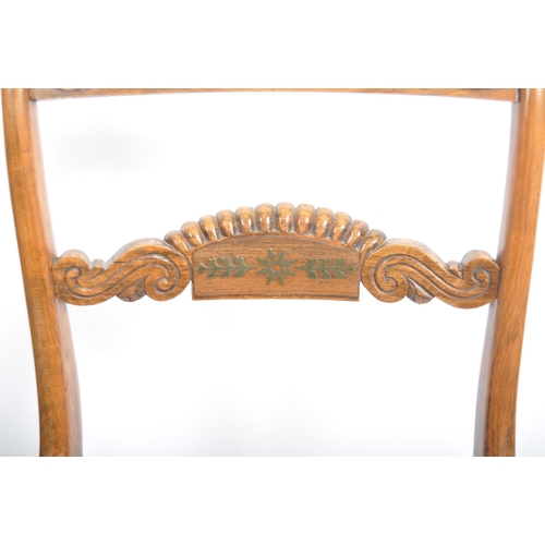 83 - A set of four early 19th Century Regency rosewood bar back dining chairs having carved brass inlaid ... 