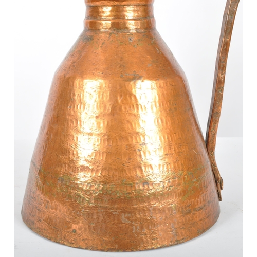 93 - A late 18th Century upcycled hammered copper ewer jug having been converted into a table lamp. The j... 