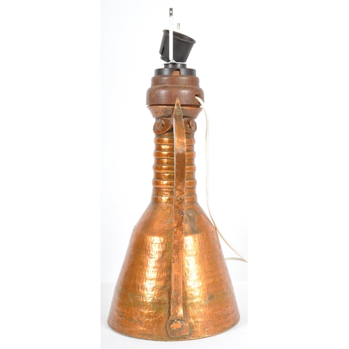 93 - A late 18th Century upcycled hammered copper ewer jug having been converted into a table lamp. The j... 