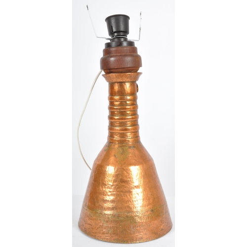 93 - A late 18th Century upcycled hammered copper ewer jug having been converted into a table lamp. The j... 