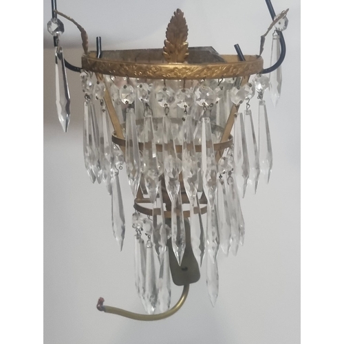 188 - A suite of early 20th Century gilt bronze and faceted glass lighting comprising a pair of mirror bac... 