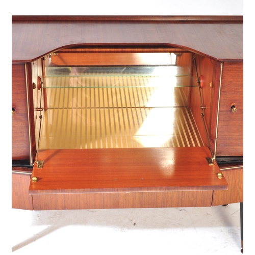 692 - Beautility - A vintage retro mid 20th century teak Beautility sideboard. The cocktail credenza havin... 