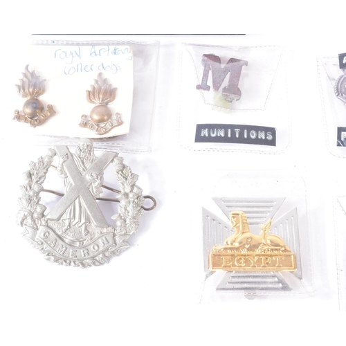 127 - A collection of assorted WWII Second World War (and other) British Military cap badges and shoulder ... 