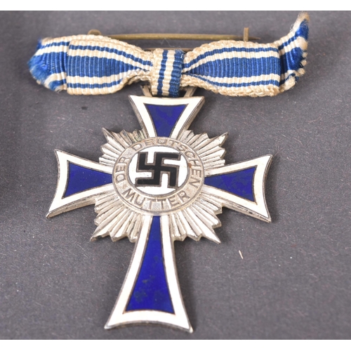 148 - Two WWII Second World War Third Reich Nazi German ' Cross of Honour of the German Mother ' medals. A... 