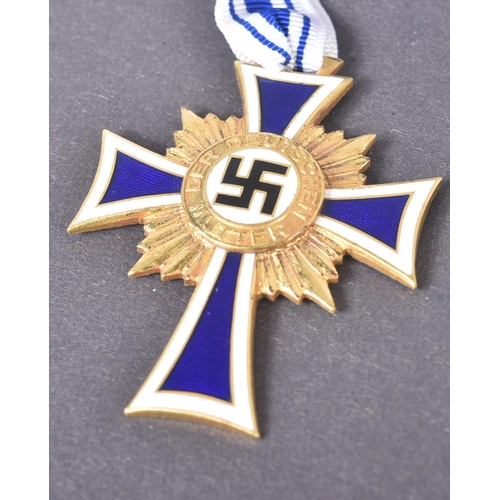 148 - Two WWII Second World War Third Reich Nazi German ' Cross of Honour of the German Mother ' medals. A... 