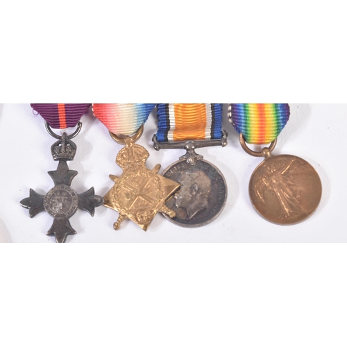 155 - A WWI First World War medal group with miniatures and a boxed MBE awarded to Lieutenant C. Mac Gilli... 