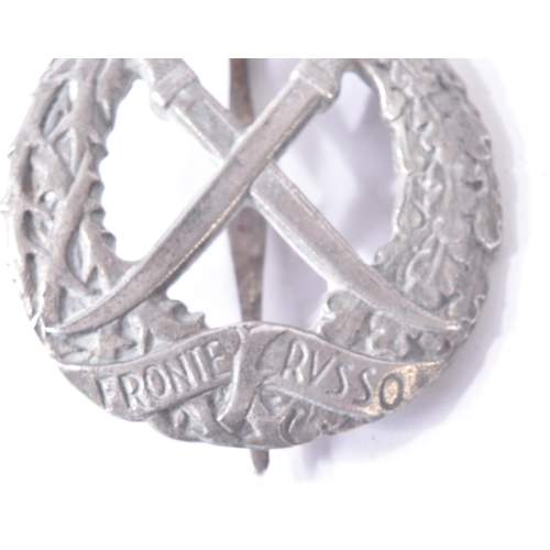 166 - A WWII Second World War Italian Fascist Front Russian / Russo badge. The silver colour badge depicti... 