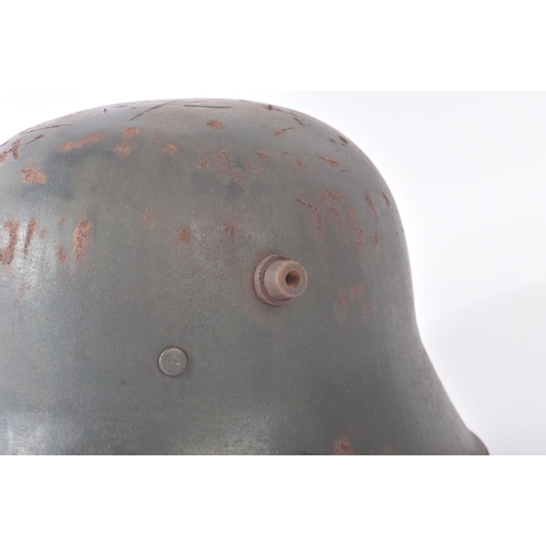 173 - A WWI First World War Imperial German M16 steel combat Stahlhelm helmet. Dark green paint with side ... 