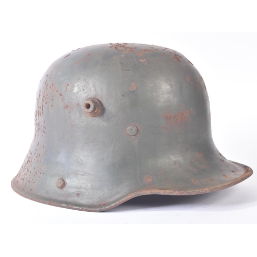 173 - A WWI First World War Imperial German M16 steel combat Stahlhelm helmet. Dark green paint with side ... 