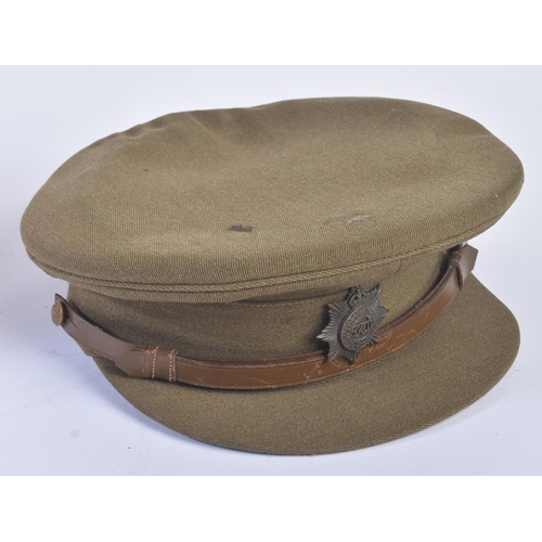 186 - A WWII Second World War Royal Indian Service Corps uniform tunic and cap. The tunic with brass RIASC... 