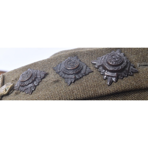 186 - A WWII Second World War Royal Indian Service Corps uniform tunic and cap. The tunic with brass RIASC... 