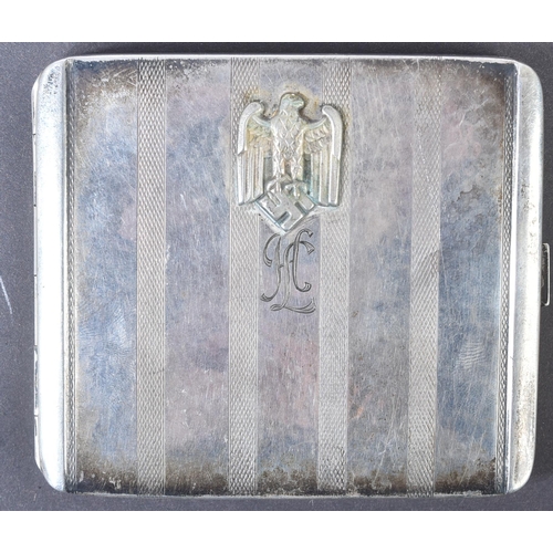 188 - A WWII Second World War Third Reich Nazi German cigarette case with applied Eagle Swastika badge and... 