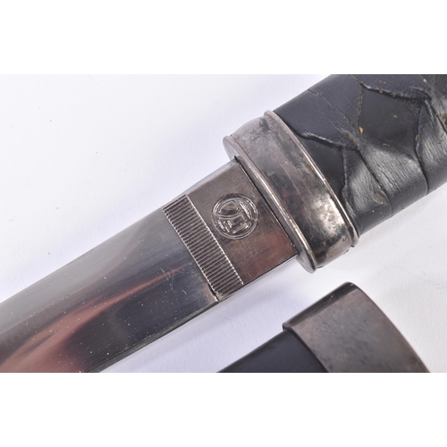 203 - A vintage Japanese Samurai Tanto knife with a plaited leather grip, metal fittings in the form of dr... 