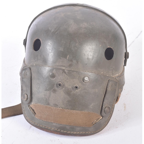 205 - A WWII Second World War US United States Tank crew M38 helmet. Compressed fibre like shell, ventilat... 