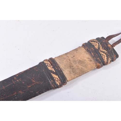 209 - A 19th Century Sudanese leather clad double edged tribal dagger / knife. Housed within its original ... 