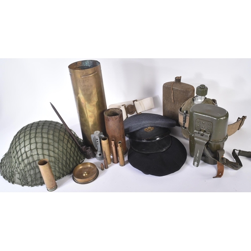 220 - A collection of assorted First, Second and post World War British militaria items to include; Tank R... 