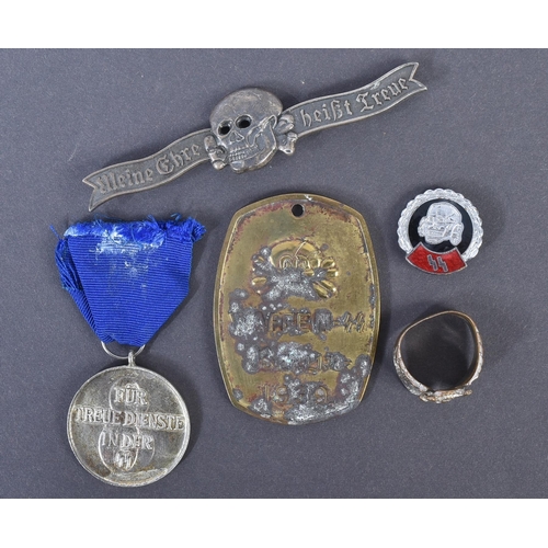 236 - A collection of assorted WWII Second World Third Reich Nazi German style badges, medals and other it... 