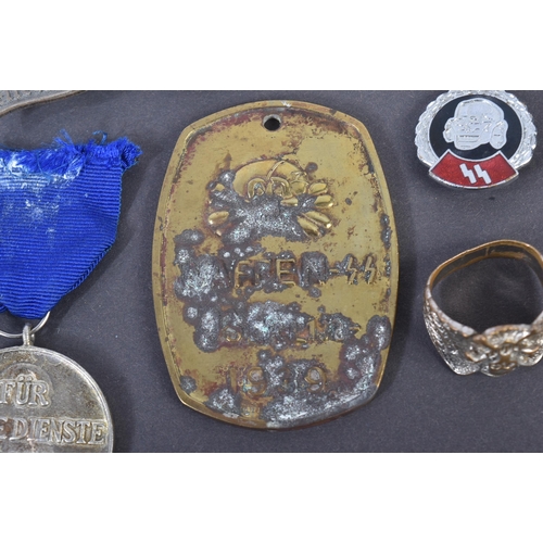 236 - A collection of assorted WWII Second World Third Reich Nazi German style badges, medals and other it... 