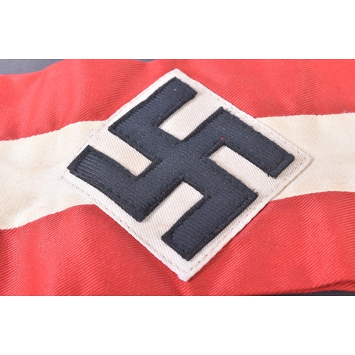 242 - A WWII Second World Third Reich Nazi German Hitler Youth armband. Red cotton with a central white ba... 