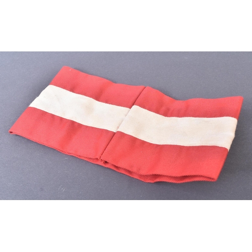 242 - A WWII Second World Third Reich Nazi German Hitler Youth armband. Red cotton with a central white ba... 