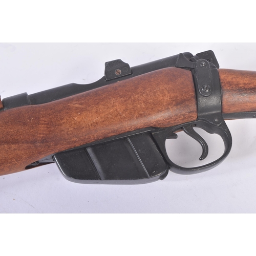 244 - A replica WWI First World War British 1914 Enfield style bolt action rifle. Dog leg style stock, int... 