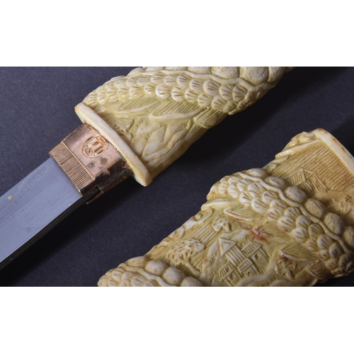 251 - A vintage Japanese style Tanto knife. Resin construction carved to a mythical dragon wrapping around... 