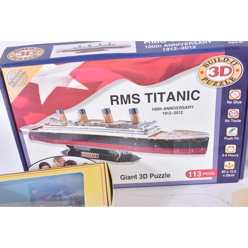 255 - RMS Titanic - a collection of assorted memorabilia to include; Gilbow RMS Titanic diecast model (box... 