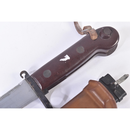 276 - A vintage Polish Type II AKM Kalashnikov rifle bayonet. The bayonet having a serrated edge to the ba... 