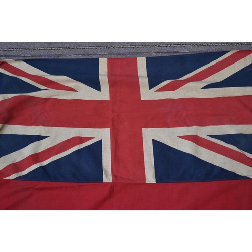 278 - An original vintage British Merchant Navy Ensign flag. Typical form with Union flag to the corner on... 