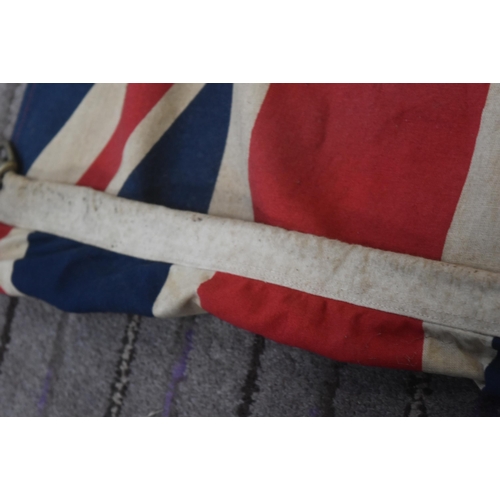 278 - An original vintage British Merchant Navy Ensign flag. Typical form with Union flag to the corner on... 