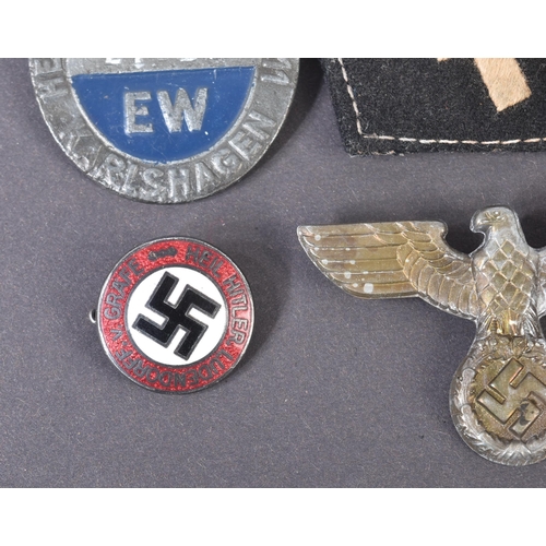 281 - A collection of assorted WWII Second World War style Third Reich Nazi German interest badges and pat... 