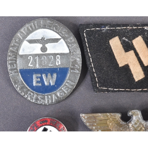 281 - A collection of assorted WWII Second World War style Third Reich Nazi German interest badges and pat... 