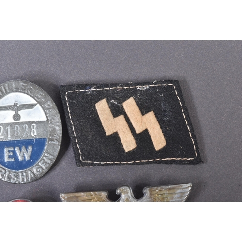 281 - A collection of assorted WWII Second World War style Third Reich Nazi German interest badges and pat... 