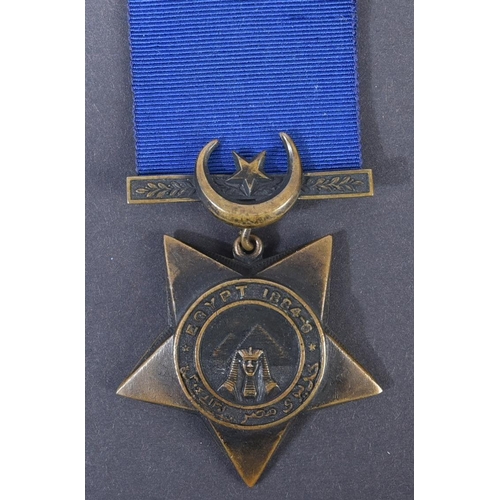 3 - A 19th Century Egypt Campaign Khedive's Star medal with Tokar clasp. The five-pointed bronze star sh... 