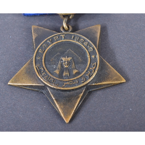 3 - A 19th Century Egypt Campaign Khedive's Star medal with Tokar clasp. The five-pointed bronze star sh... 