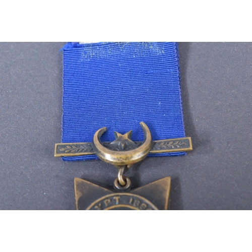 3 - A 19th Century Egypt Campaign Khedive's Star medal with Tokar clasp. The five-pointed bronze star sh... 