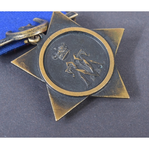 3 - A 19th Century Egypt Campaign Khedive's Star medal with Tokar clasp. The five-pointed bronze star sh... 