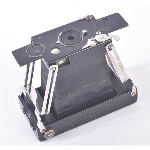 303 - A WWI First World War British Army Officers compact folding camera. Black painted brass body, leathe... 