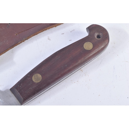 304 - A 20th Century vintage hunting knife. Hooked wooden grip secured with two rivets and a clipped blade... 