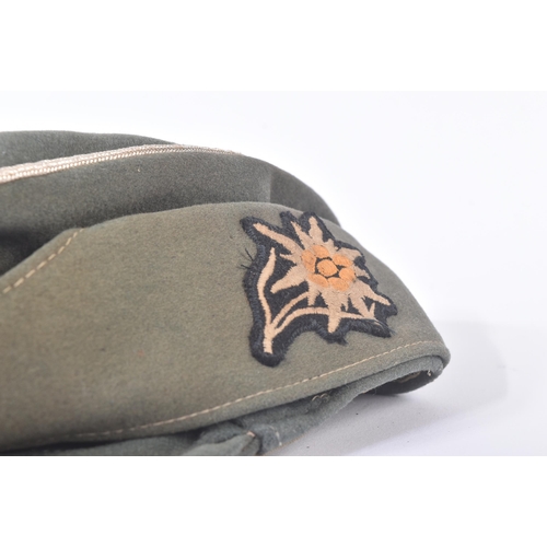 306 - A WWII Second World War Third Reich Nazi German Waffen SS Mountain Troop M43 field cap. Green wool e... 