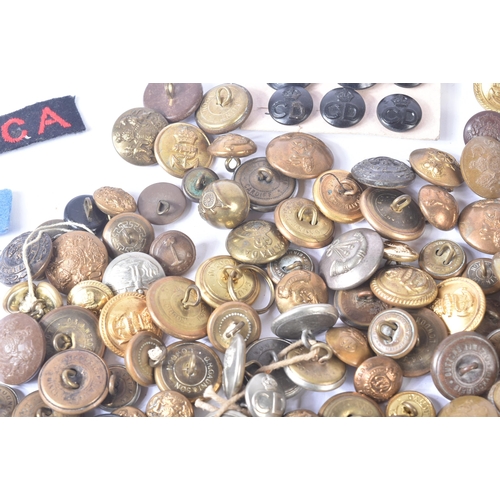 317 - A collection of assorted First and Second World War (and later) military uniform buttons and cloth p... 