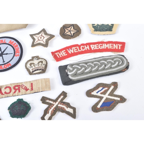 317 - A collection of assorted First and Second World War (and later) military uniform buttons and cloth p... 