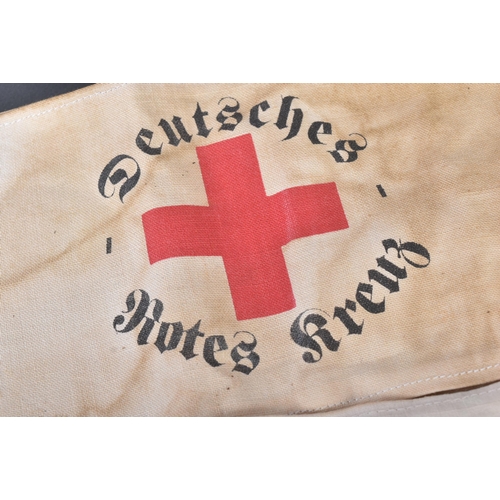 323 - Two WWII Second World War Third Reich Nazi German DRK / Red Cross armbands and belt buckle. The belt... 