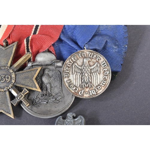 335 - A post WWII Second World War 1950s German Third Reich Denazified medal group. Medals comprising Iron... 