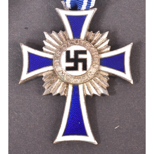 338 - Two WWII Second World War Third Reich Nazi German ' Cross of Honour of the German Mother ' medals. A... 