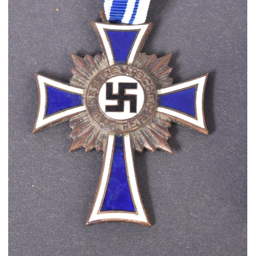 338 - Two WWII Second World War Third Reich Nazi German ' Cross of Honour of the German Mother ' medals. A... 