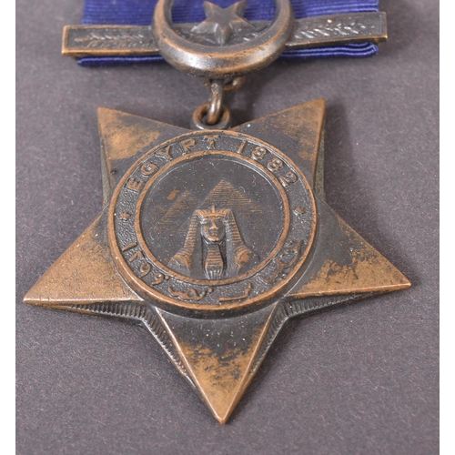 34 - A 19th Century Egypt Campaign Khedive's Star medal with Tokar clasp. The five-pointed bronze star sh... 