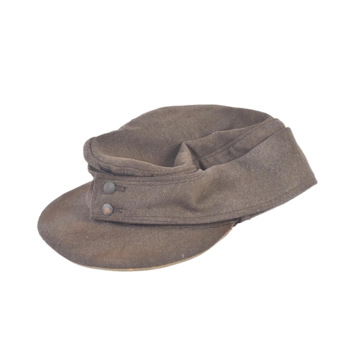 358 - A WWII Second World War Third Reich Nazi German M43 Wehrmacht forage cap. Khaki wool construction wi... 